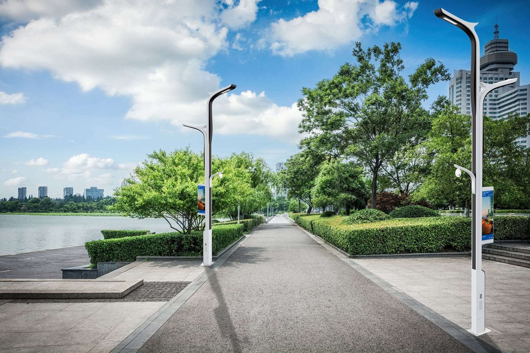 White smart poles lining a waterfront park promenade